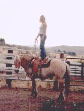 Katie Lay standing atop harmony, 4th day of training