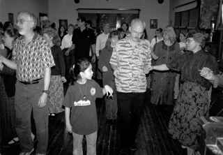 Dancers come up the hall.